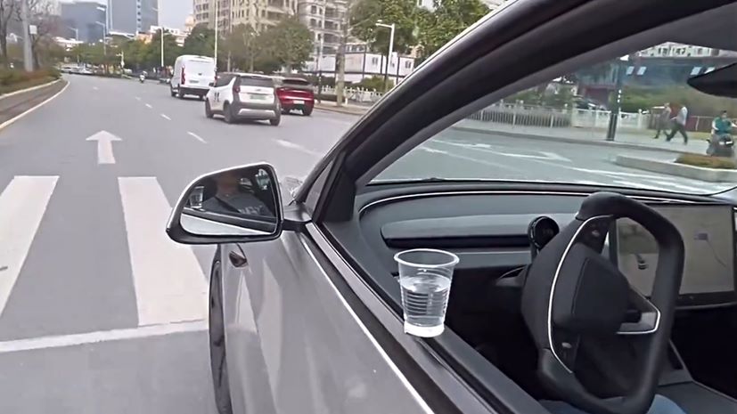 Tesla FSD cup water